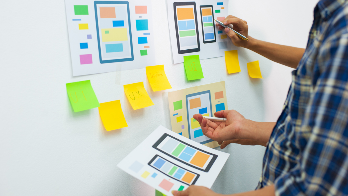 Website deisgners working at board