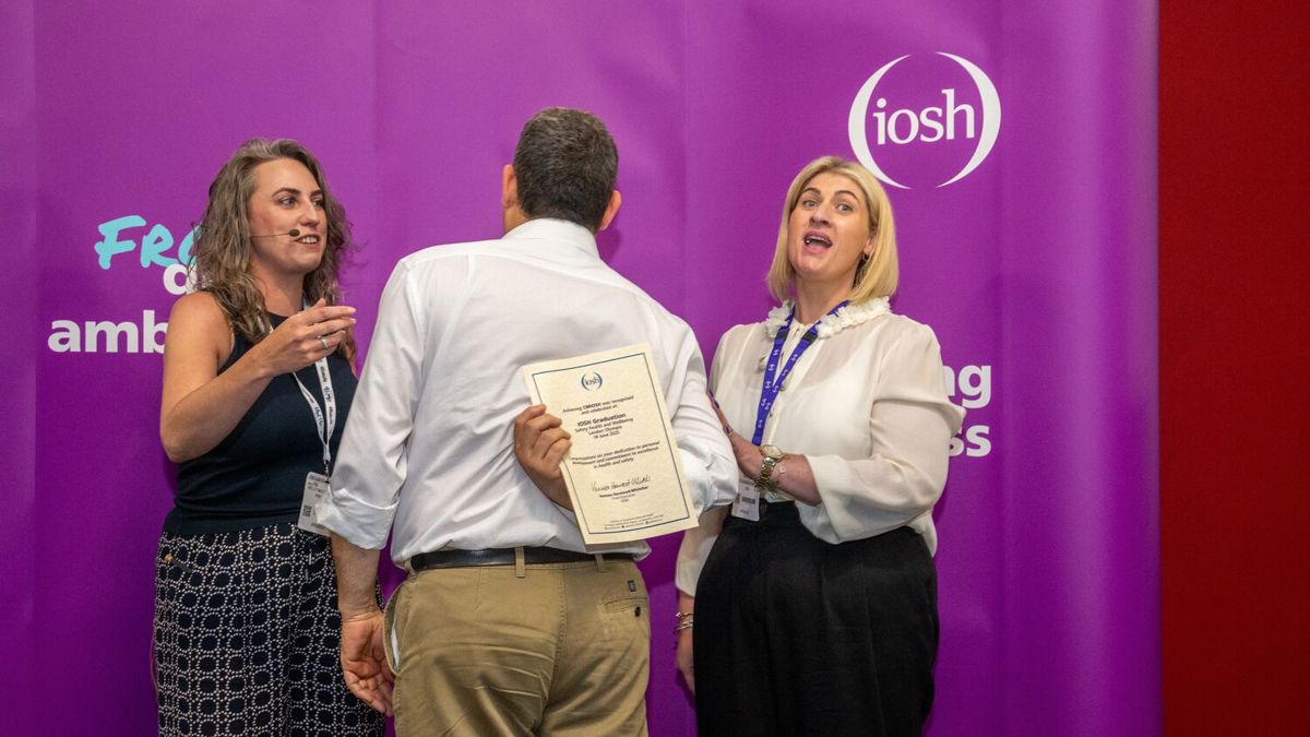 IOSH President Kelly Nicoll and staff member Kirsty Dickens awarding a Chartered Membership certificate