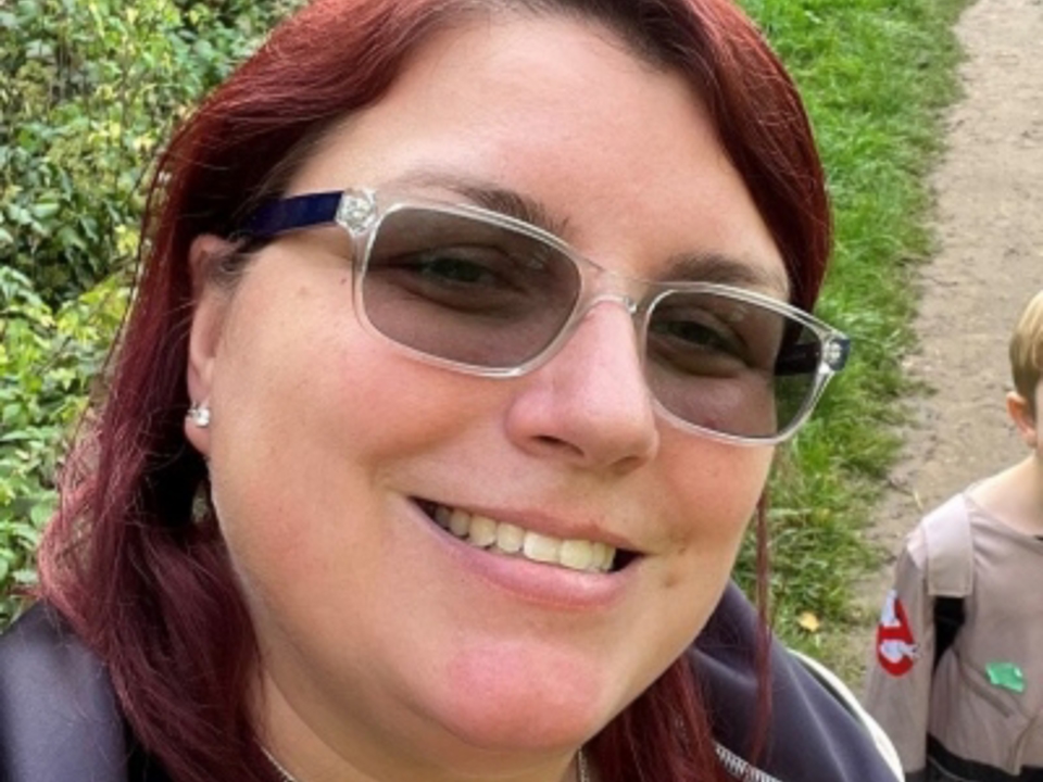 Emma Burdette smiling in glasses