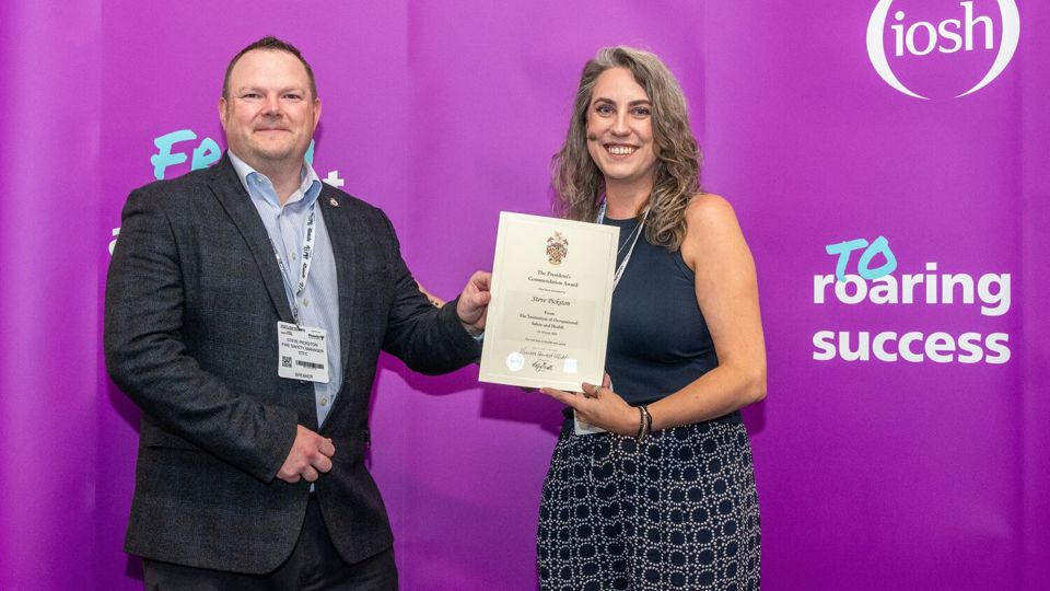 Steve Pickston receieves a President's Commendation Award from Kelly Nicoll