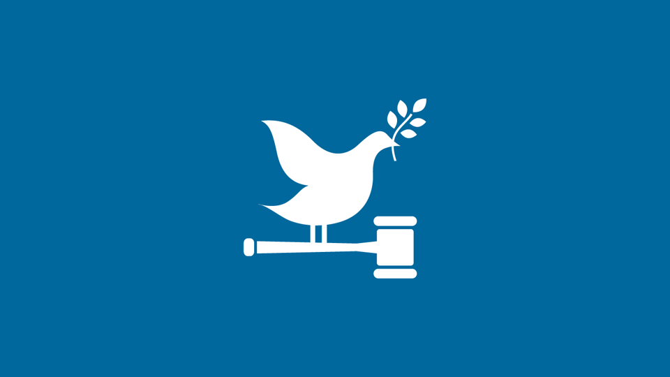 icon of bird with leaf in beak perched on a hammer