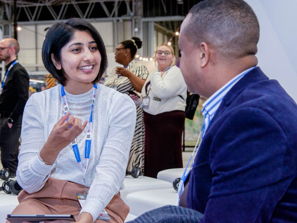 Delegate speaks to IOSH staff member at conference