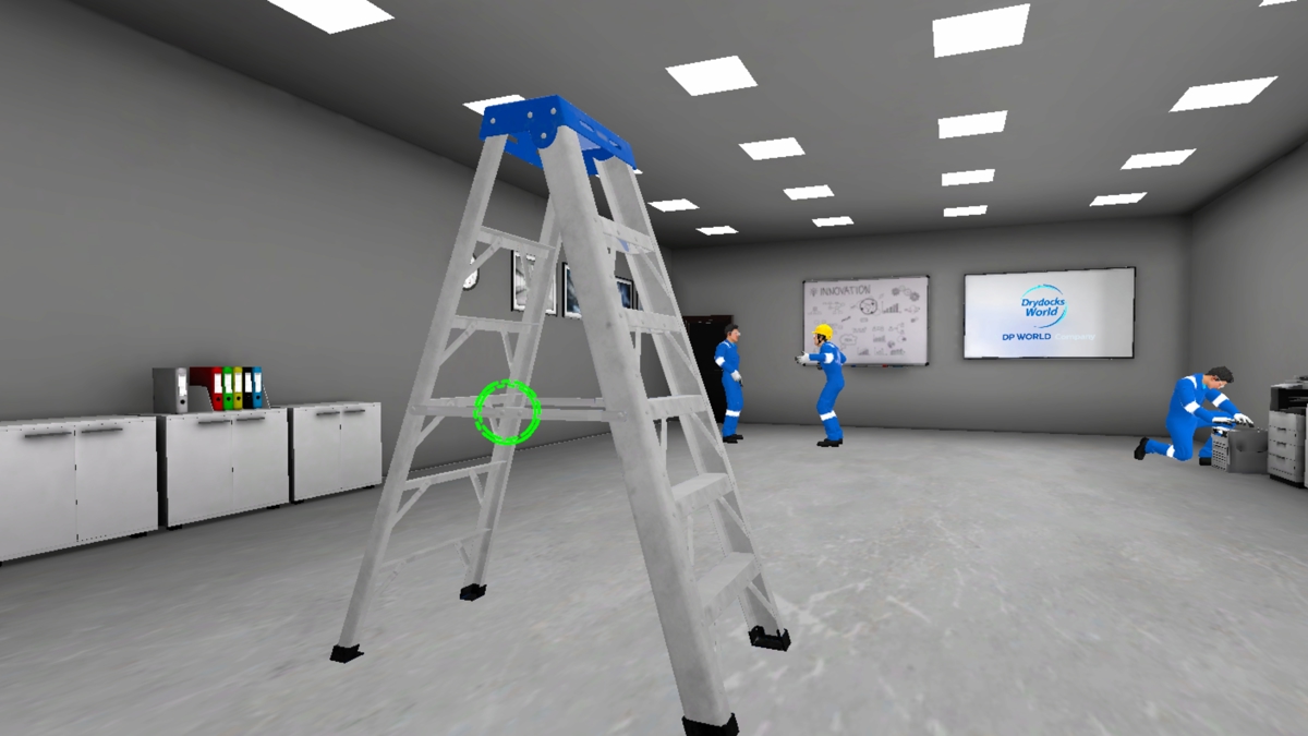 VR training scene in a gray room with bright ceiling lights. A ladder stands in the foreground, and three workers in blue safety uniforms are performing tasks near cabinets and screens displaying “INNOVATION” and “Drydocks World.”