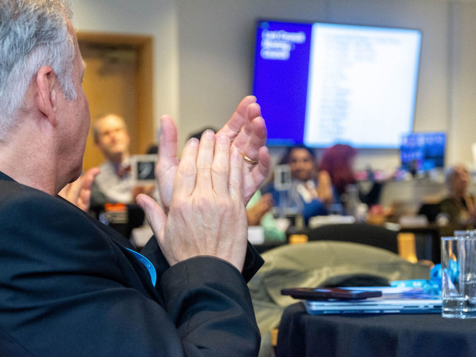 Man clapping during IOSH Council meeting