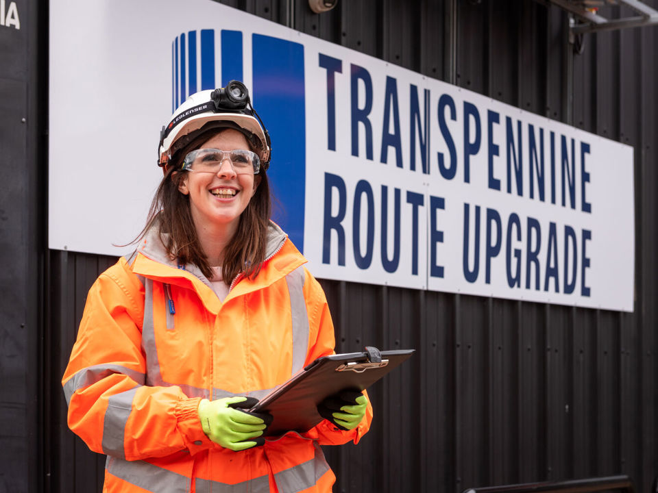 IOSH member in PPE holding clipboard