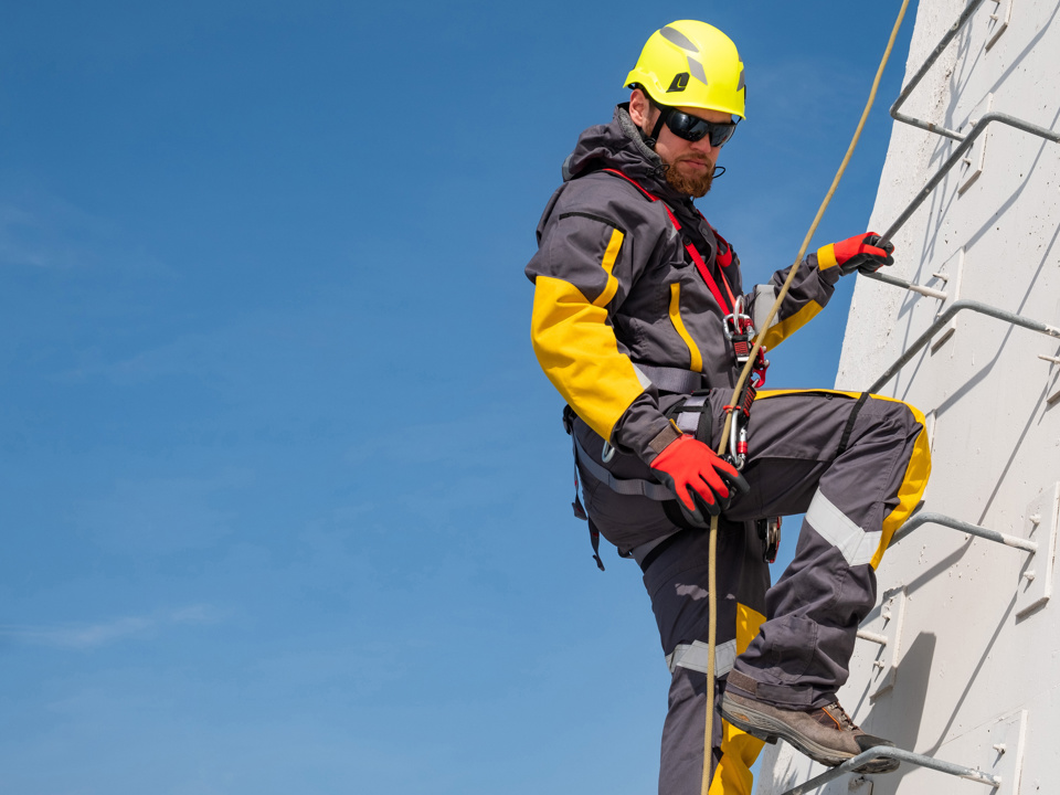 Man in PPE equipment working at height