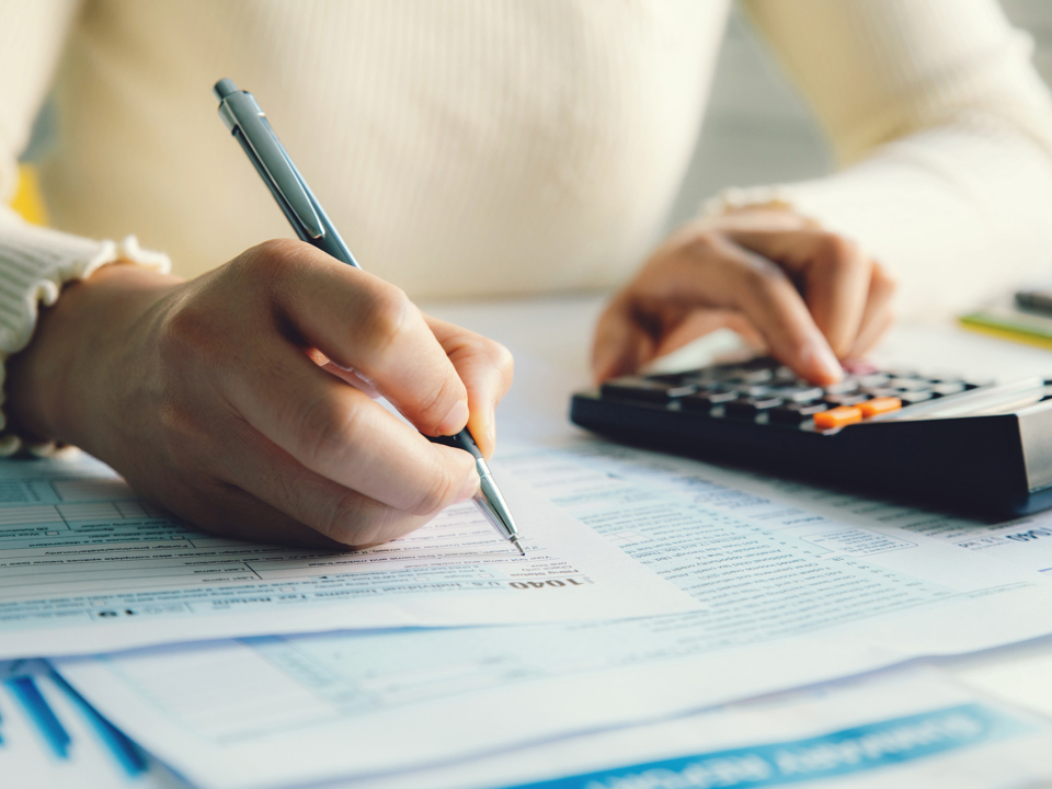 Woman using a calculator