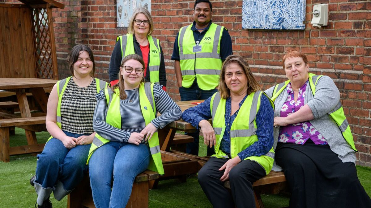 Mental health first aid team sitting on picnic bench