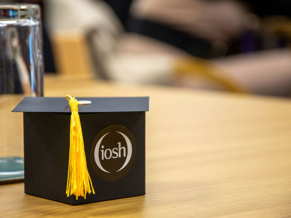 Mini IOSH mortar board on a desk