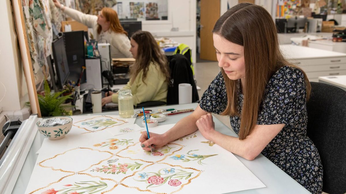 Standfast and Barracks fabric designer working at desk