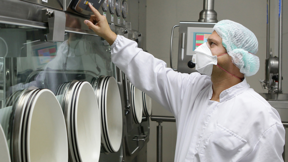 Man checking machinery in food factory