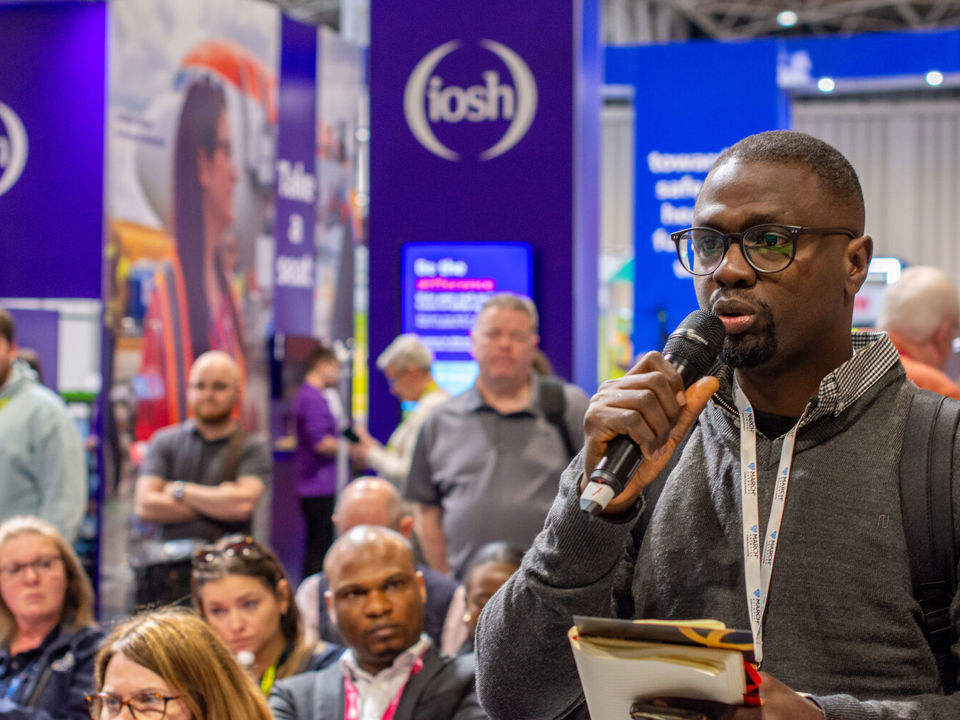 An appreciative audience applauds at a conference