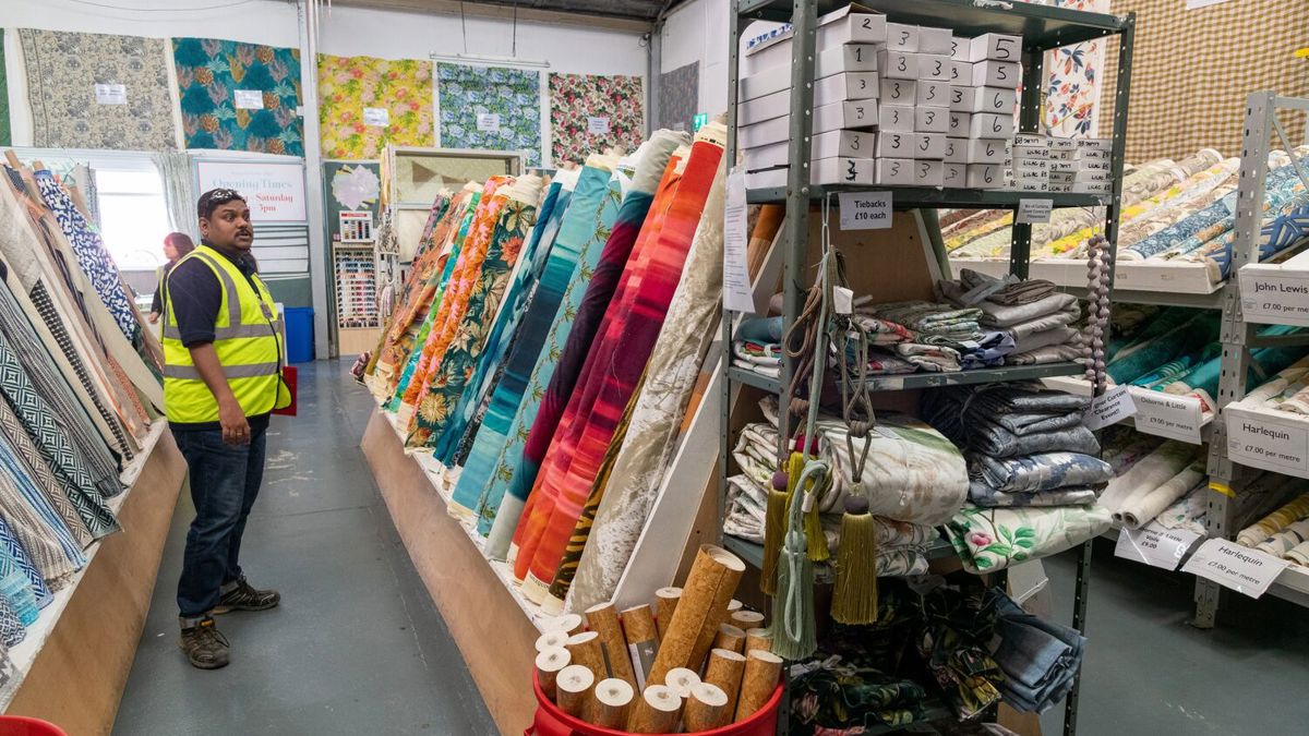 IOSH member Chandrasekhar Shajahan looking at rolls of printed fabric