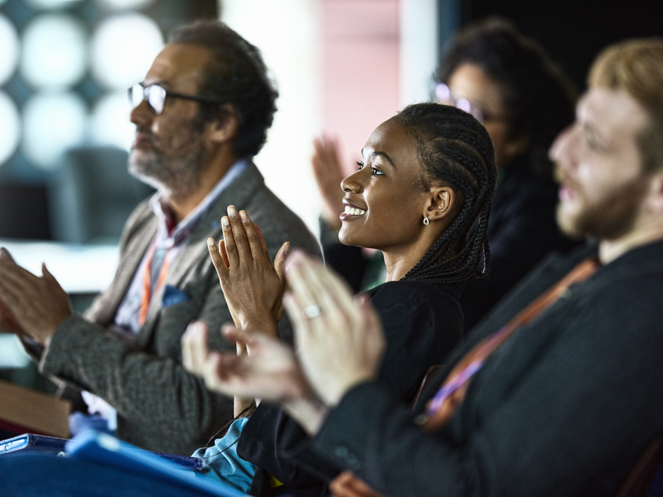 Crowd clapping at an event