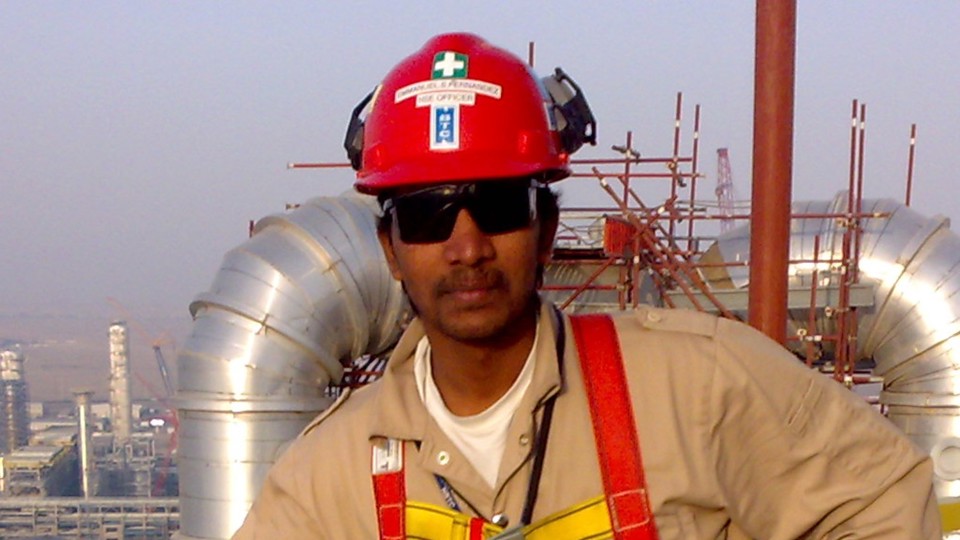 Emmanuel Fernandez, Chartered Member of IOSH on a high platform wearing full personal protective equipment