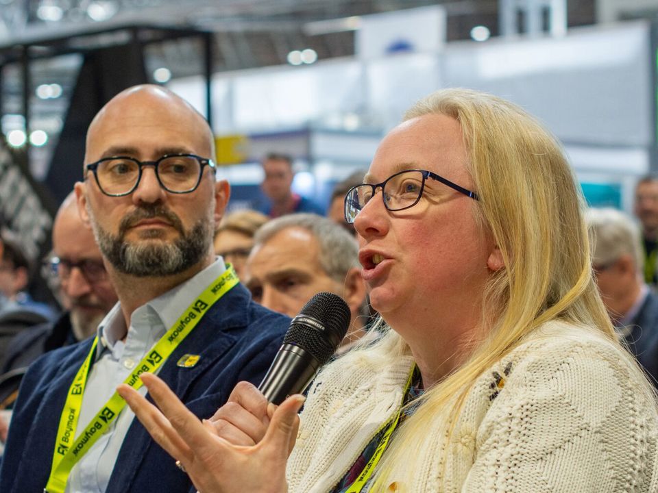 Heather Fitsell with microphone and Rupert Crayston